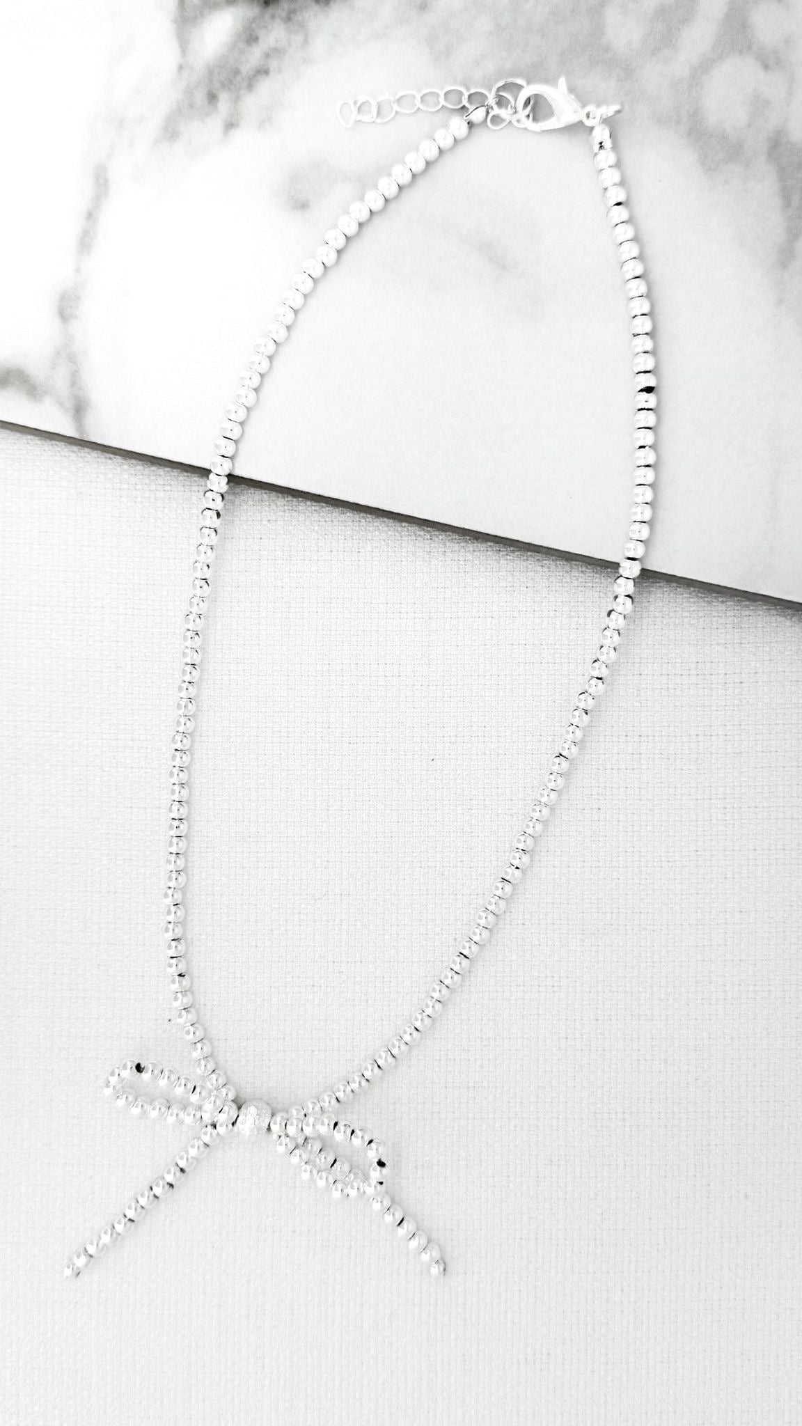 ENVY Short Silver Bow Necklace