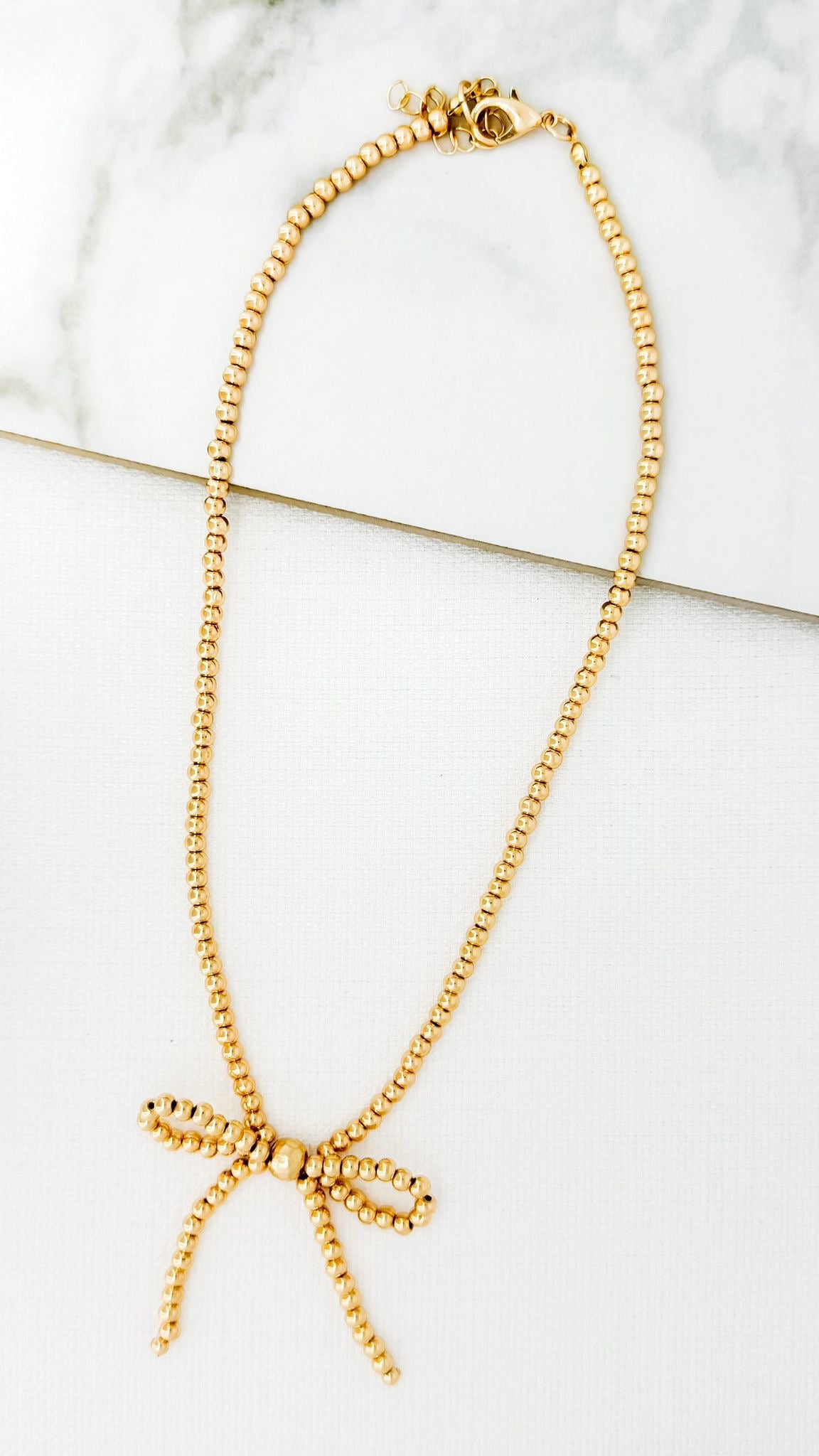 ENVY Short Gold Bow Necklace